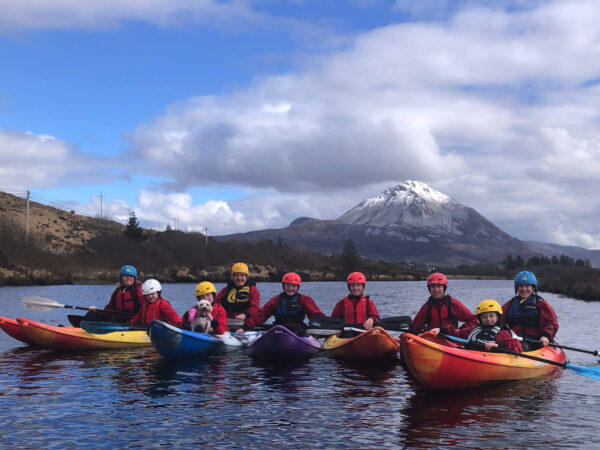 Group of parents and kids kayaking on Dunlewey Lake